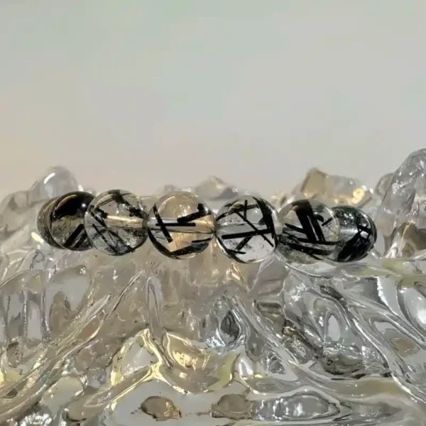 Close-up of black rutile quartz crystal beads