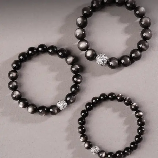 Three styles of silver obsidian energy bracelets with fortune beads