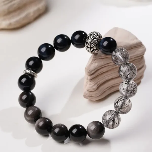 Side view of gemstone bracelet with mixed dark crystals