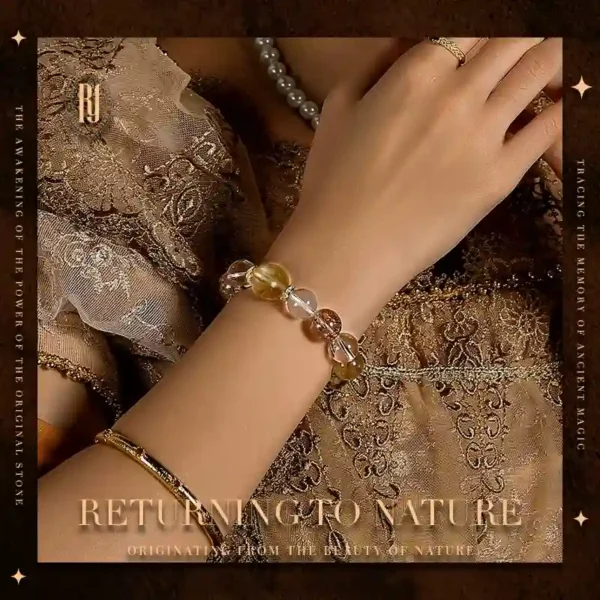 Close-up of luxury crystal bracelet on model’s wrist featuring golden quartz and super seven