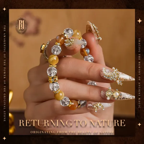 Detailed view of faceted quartz and golden gemstone bracelet in hand