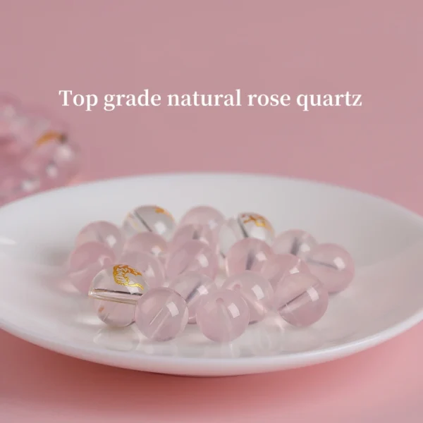 Group of rose quartz zodiac bracelets displayed on white pedestals