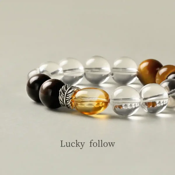 Citrine bead and black obsidian detail in wealth bracelet
