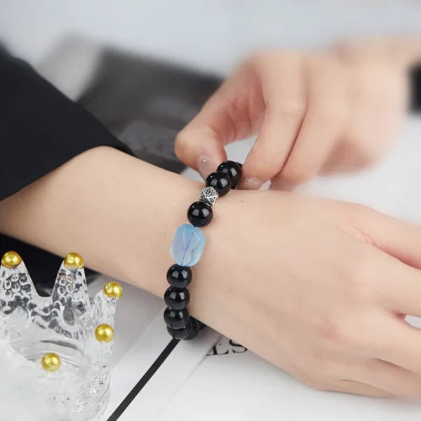Obsidian and Aquamarine Bracelet on Wrist for Energy Boost