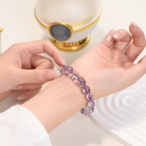 Woman wearing purple amethyst bracelet