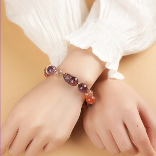 Woman wearing purple energy Pixiu bracelet