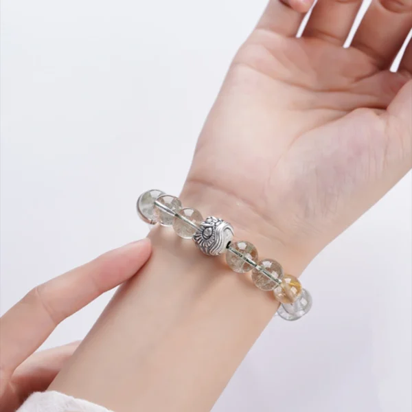 Woman wearing silver lion head crystal bracelet