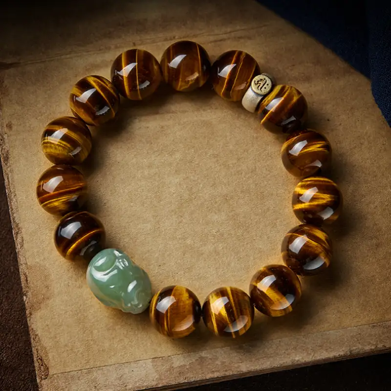A luxurious bracelet crafted from polished Yellow Tiger Eye beads, featuring a detailed Hetian Jade Pixiu charm and 925 silver zodiac element.