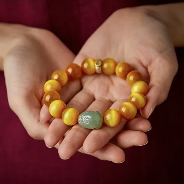 Bracelet combining Yellow Tiger Eye beads, Hetian Jade Pixiu, and 925 silver zodiac guardian charm