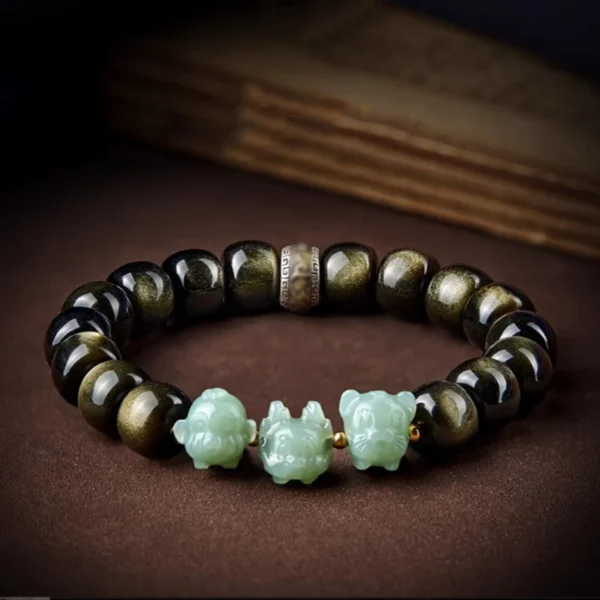 Zodiac Guardian Bracelet featuring golden obsidian beads and Hetian jade Pixiu charm, perfect for zodiac protection and prosperity