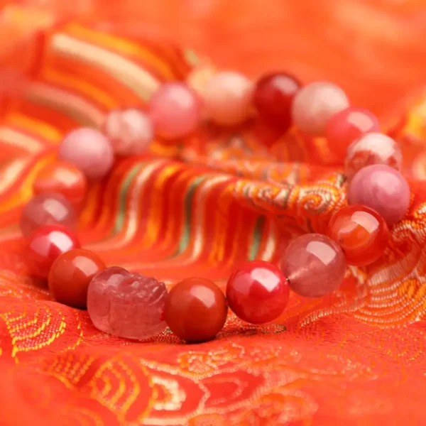 Close-up of carved Strawberry Quartz Pixiu centerpiece