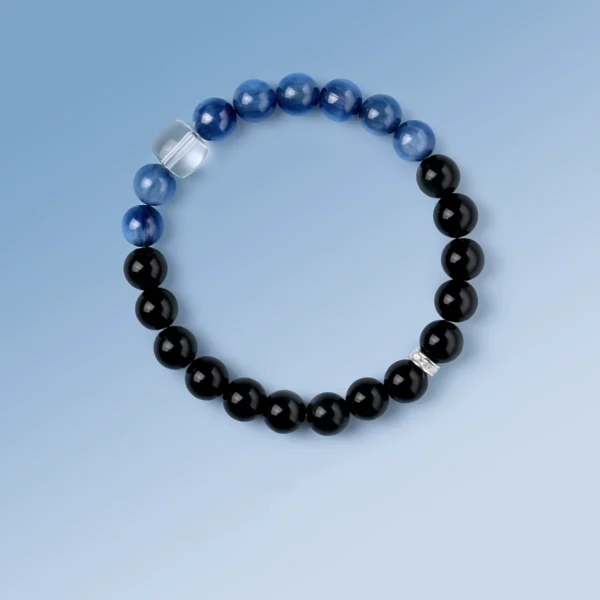 Flat-lay view of Guardian Realm bracelet featuring black obsidian and blue kyanite