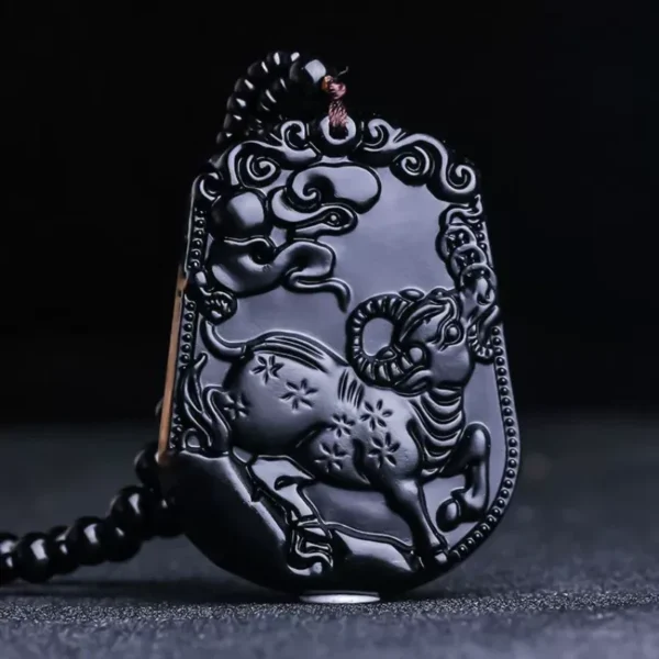 Chinese Zodiac Ox pendant carved in black obsidian, symbolizing determination and resilience