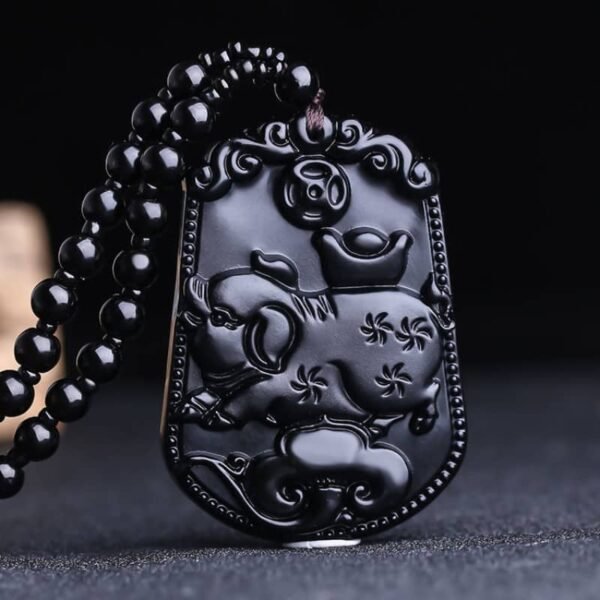 Obsidian pendant showcasing the Pig, symbolizing wealth, kindness, and satisfaction