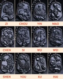 A complete set of 12 Chinese Zodiac Black Obsidian Pendants, placed in a circular feng shui layout.