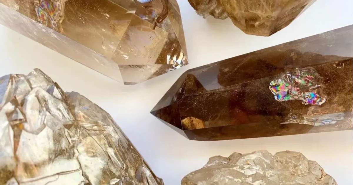 Display of natural smoky quartz in rough and cut crystal forms