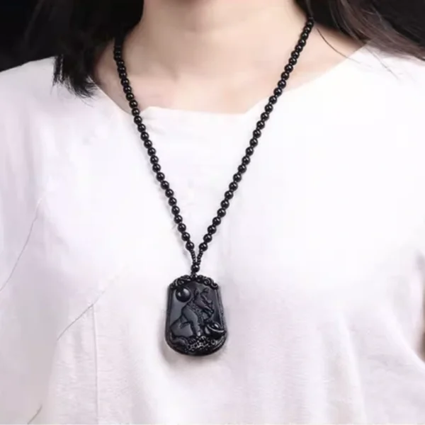 Complete set of twelve Chinese zodiac obsidian pendants arranged in a circle